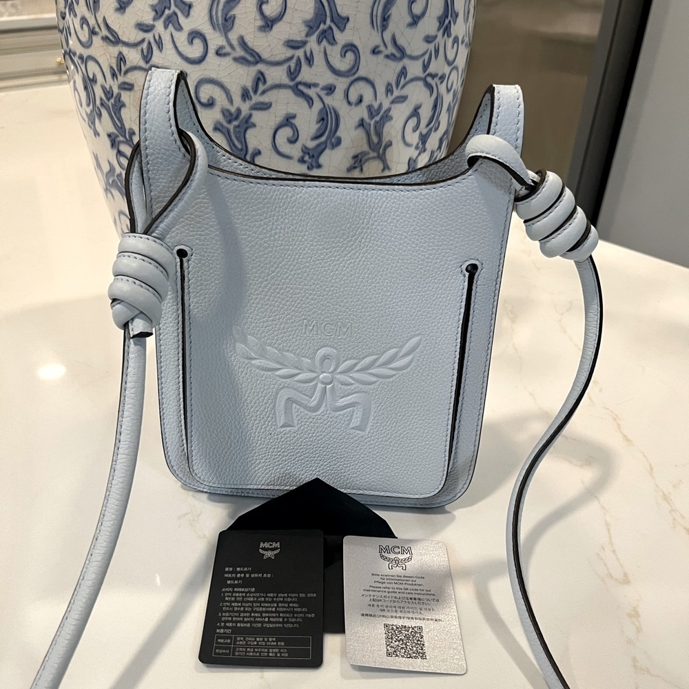 MCM Blue Crossbody Bag with Adjustable Strap and Embossed Logo